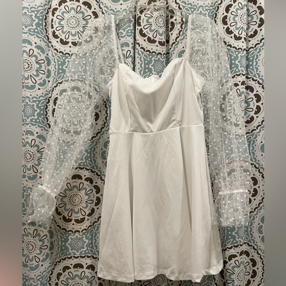 White dress with sheer polka dot sleeve